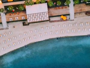 an overhead view of a pool at a hotel at The Bodrum Hotel Yalıkavak - MGallery Collection in Yalıkavak +267 photos
