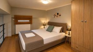 a bedroom with a large bed in a room at Deodonum Luxury Apartments in Heraklio