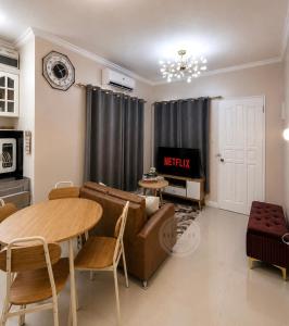 a living room with a couch and a table at Cozy Home in Dipolog by Aveinz in Dipolog