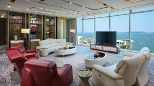 a living room filled with furniture and a flat screen tv at InterContinental Xiamen by IHG in Xiamen
