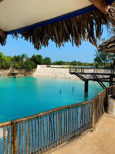 a view of a body of water with a bridge at Mar & Sol Preá - 700m da Praia - 12km de Jeri - 15km do Aeroporto in Prea