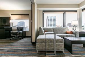 a living room with a couch and a desk at Holiday Inn & Suites Chattanooga Downtown by IHG in Chattanooga