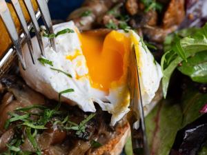 a fried egg on top of a plate of food at Mercure Paris Centre Gare Montparnasse in Paris
