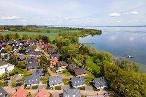 an aerial view of a small town next to a lake at Strandhaus-3-EG in Marienfelde +16 photos