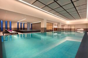 a large swimming pool in a hotel room at Crowne Plaza Wuzhen by IHG in Tongxiang