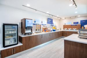 a store with wooden cabinets and a food counter at Holiday Inn Express Wilson I-95 by IHG in Wilson