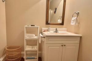 a bathroom with a sink and a mirror at Shambhala Retreat-Zen Suite in Nanoose Bay +31 photos