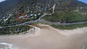 an aerial view of a road next to a beach at Moggs View in Aireys Inlet