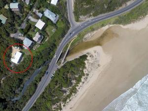an aerial view of a house next to a road at Moggs View in Aireys Inlet