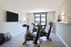 a gym with two tread machines in a room at INNSiDE by Meliá Frankfurt Ostend in Frankfurt