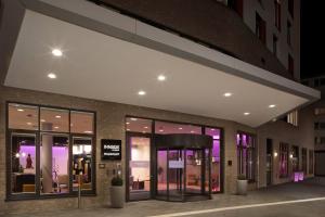 a store front of a building at night at INNSiDE by Meliá Frankfurt Ostend in Frankfurt +27 photos