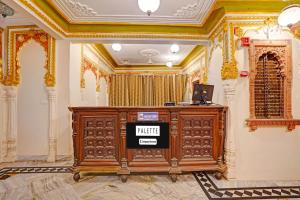 a room with a podium in the middle of a building at Palette Hotel and Resorts Jodhpur Airport Formerly Royale Plazo in Jodhpur