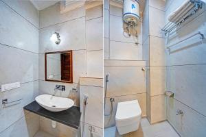 a bathroom with a toilet and a sink and a shower at Palette Hotel and Resorts Jodhpur Airport Formerly Royale Plazo in Jodhpur