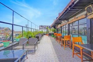 an empty patio with tables and chairs on a building at Palette Hotel and Resorts Jodhpur Airport Formerly Royale Plazo in Jodhpur