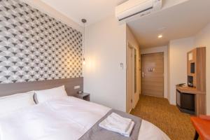 Voodi või voodid majutusasutuse Hotel M's Plus Shijo Omiya toas