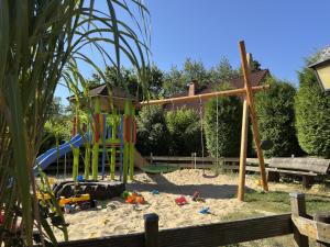 a playground with a slide at Ferienwohnung mit Loggia im Teutoburger Wald in Bredenborn
