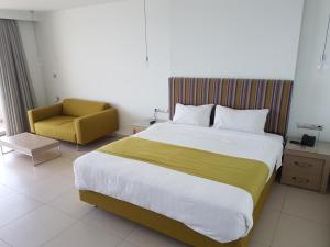 Postel nebo postele na pokoji v ubytování El Greco Hotel
