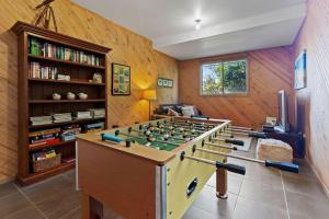 a room with a foosball table in the middle at Otway Views in Apollo Bay