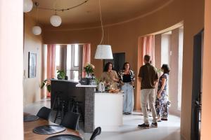 a group of people standing in a kitchen at Ystads Gamla Vattentorn in Ystad
