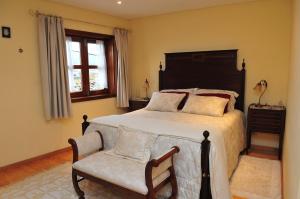Tempat tidur dalam kamar di Outros Tempos - Turismo de Aldeia