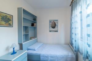 Posteľ alebo postele v izbe v ubytovaní Apartments Mirella