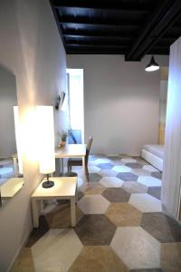 a living room with a checkered floor at Residence Stendhal Guest House in Civitavecchia