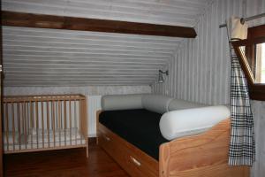 Katil atau katil-katil dalam bilik di Chalet Ardenne Mini