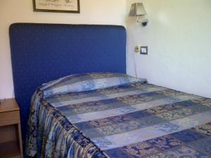 Postel nebo postele na pokoji v ubytování Albergo Rossella