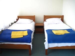 A bed or beds in a room at Hotel Kujawy