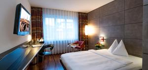 Postel nebo postele na pokoji v ubytování Hotel Sternen Oerlikon
