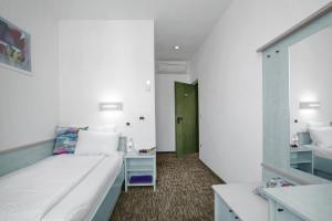 Postel nebo postele na pokoji v ubytování Lipa, Hotel & Bistro