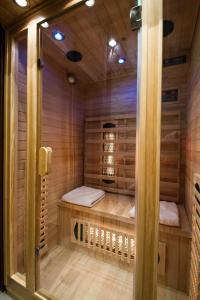 a sauna with two beds and a bird cage at Quality House - Cisza nad Doliną in Zakopane +38 photos