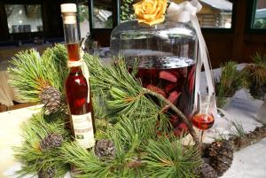 a bottle of wine and a glass on a table at Pension Pürcherhof in Gröbming