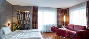 Postel nebo postele na pokoji v ubytování Hotel Sternen Oerlikon