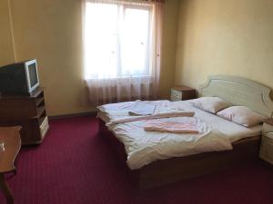 Ένα ή περισσότερα κρεβάτια σε δωμάτιο στο Power House Hotel +24 φωτογραφίες