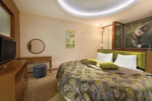 Ramada by Wyndham Podgorica客房内的一张或多张床位