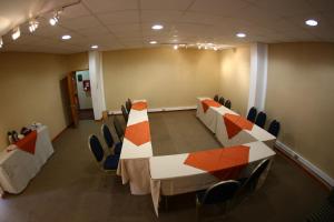 a conference room with a long table and chairs at Hotel Puerto de Vega in Vallenar +58 photos