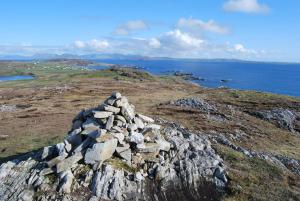 a pile of rocks on top of a mountain at Dolphin Hotel in Inishbofin