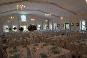 a large banquet hall with tables and chairs at Halliwell Country Inn in Howick +24 photos