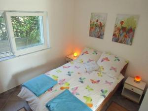 Postel nebo postele na pokoji v ubytování Apartment Kolman