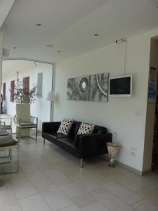 TV a/nebo společenská místnost v ubytování Hotel Pierre