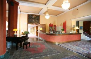 a lobby with a piano and a desk in it at Grand Hotel Bellavista Palace & Golf in Montecatini Terme +117 photos