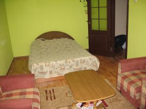 Ένα ή περισσότερα κρεβάτια σε δωμάτιο στο Apartment on Vasylya Chervoniya 67