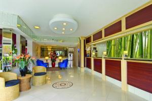 a lobby of a hospital with blue chairs at Tiki Resort - Lake George in Lake George