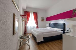 Voodi või voodid majutusasutuse Hotel Croce Federale toas