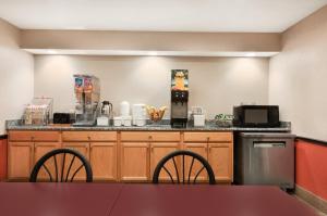 A kitchen or kitchenette at Super 8 by Wyndham Rantoul