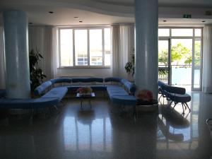 Postel nebo postele na pokoji v ubytování Hotel Maxim's