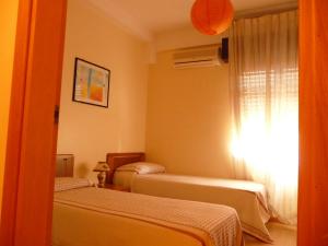 Cama ou camas em um quarto em Agathae Hotel & Residence