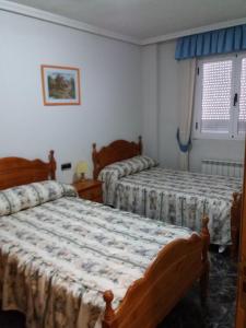 Postel nebo postele na pokoji v ubytování Casa Rural Amelia