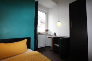 Postel nebo postele na pokoji v ubytování Stadthotel Kleiner Berg